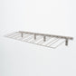 Wine bottle wall rack with light metal finish and slanted wire bottle holders