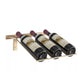 Wall-mounted wine bottle rack holding three dark bottles with burgundy corks.