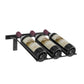 Wall-mounted wine bottle rack holding three dark bottles with burgundy corks.