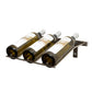 Wall-mounted wine bottle rack holding 3 bottles, dark metal frame with neck rests