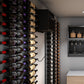 Wine cellar cooling system with dense wine bottle racks and wall control unit