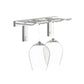 Wall-mounted stemware rack with clear glass hooks holding wine glasses
