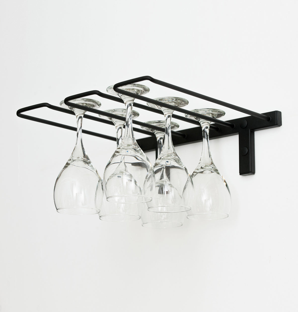 Black wall-mounted stemware rack holding six wine glasses