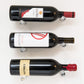 Set of wall-mounted wine bottle pins with metal bases holding three bottles