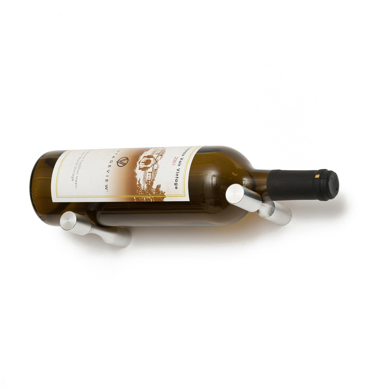 Wine bottle holder pins with gunmetal prongs on a golden glass wine bottle