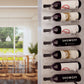 Wall-mounted wine bottle display with multiple bottles in holders