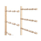Golden bronze wine bottle rack with cylindrical bottle holders, close side view