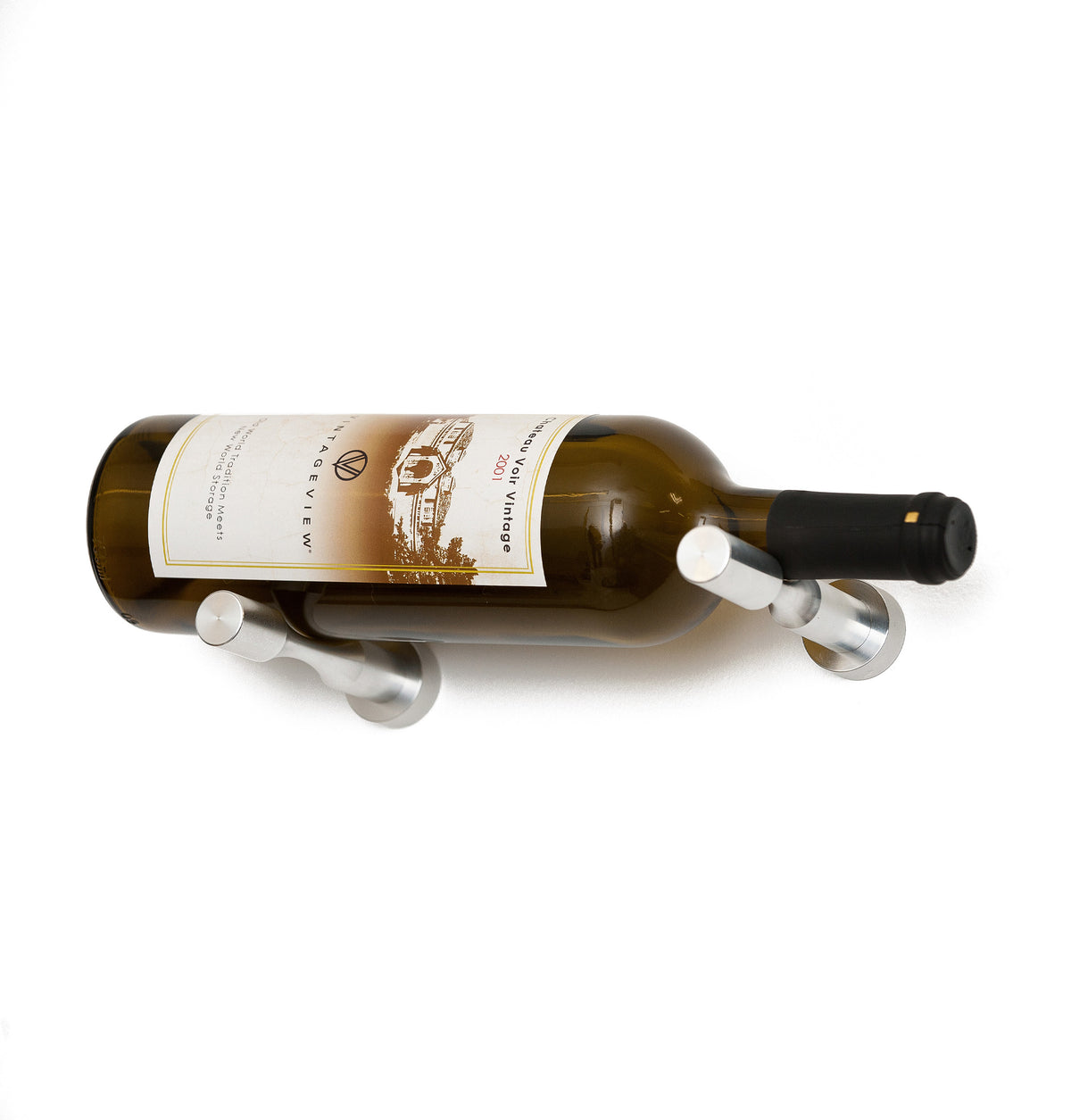 Wine bottle holder pins with gunmetal prongs on a golden glass wine bottle