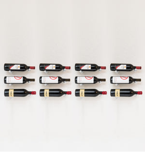 Wine bottle rack pins holding 12 bottles on black holders, front view