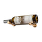 Wine bottle display pin with golden bronze finish holding an amber bottle