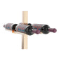 Double-sided bottle holder bar with black rails and bronze bracket, purple-cork bottles