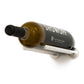 Wine bottle rail holding a bottle on a chrome-like bar with round end caps
