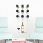 Wine bottle rail with multiple bottle slots and mounting screws, wall display