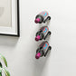Wall-mounted 3x1 wine rail with three angled bottle holders in dark metal
