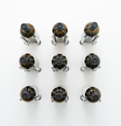3x3 wine bottle rail with nine dark bottle holders and wine bottles