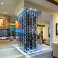 Glass-enclosed wall wine rack with black frame and rows of wine bottles