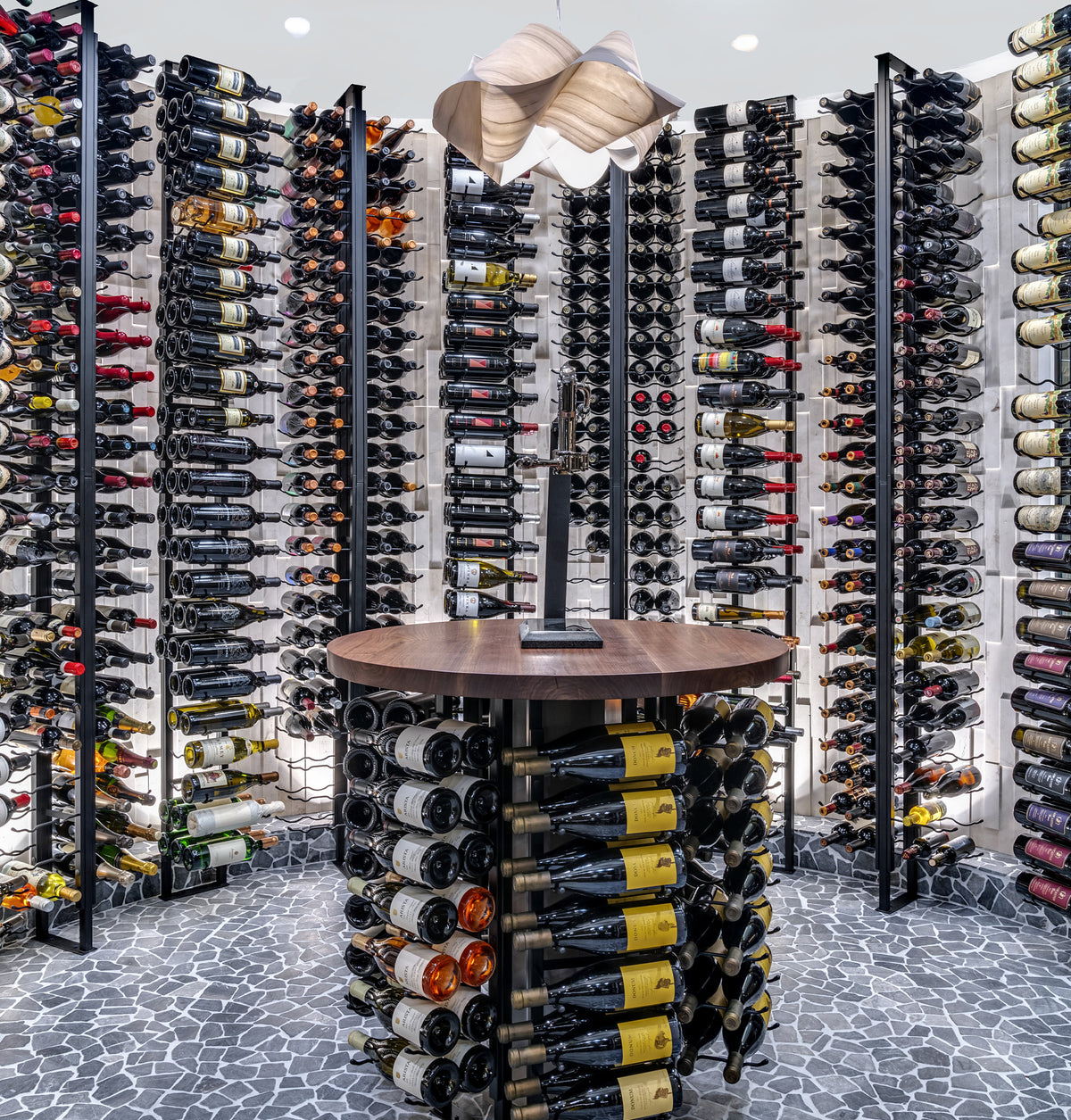 Wine storage wall with metal bottle rails and floating frame section