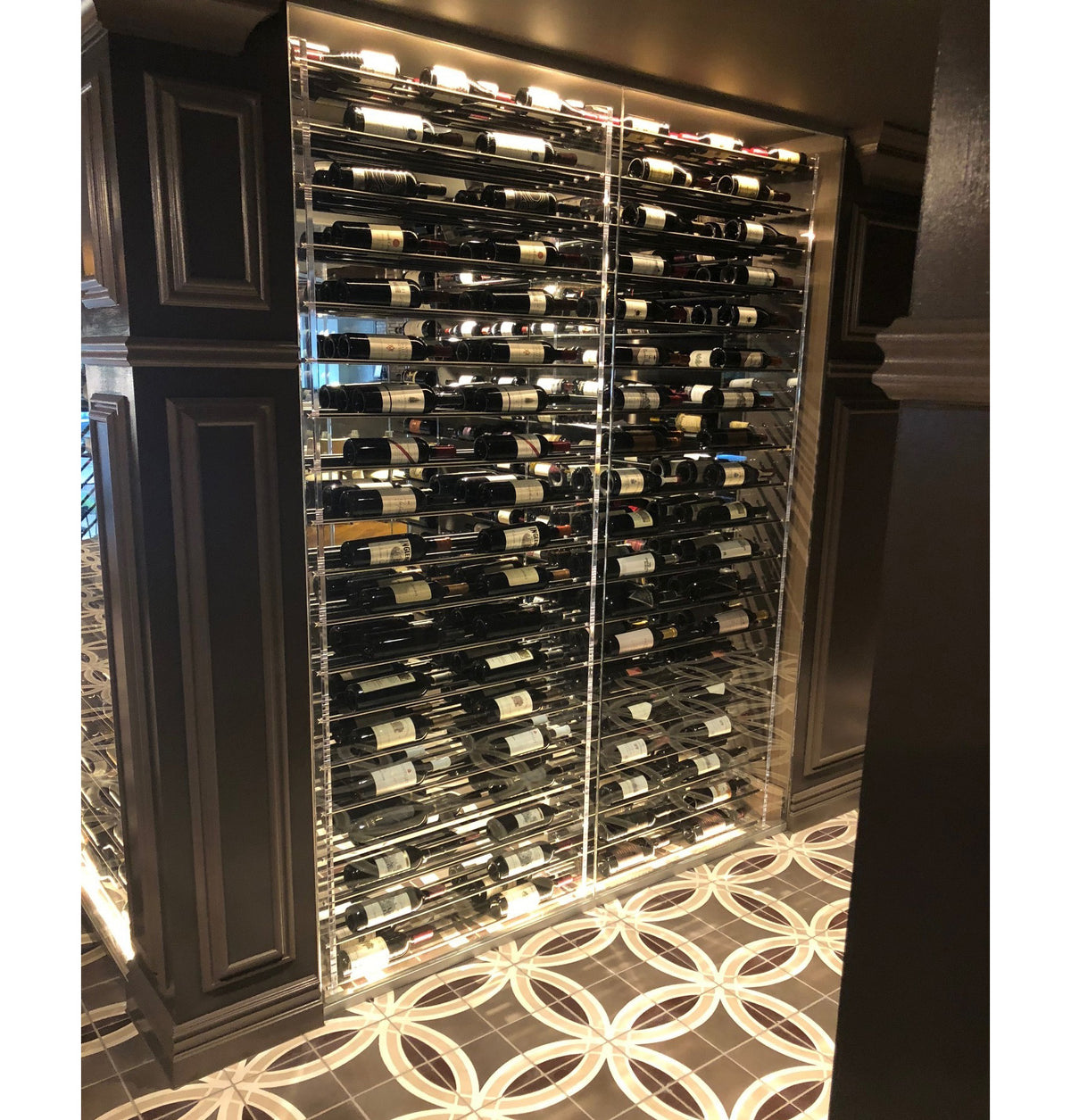Glass wine display tower with internal metal racks and bottle holders