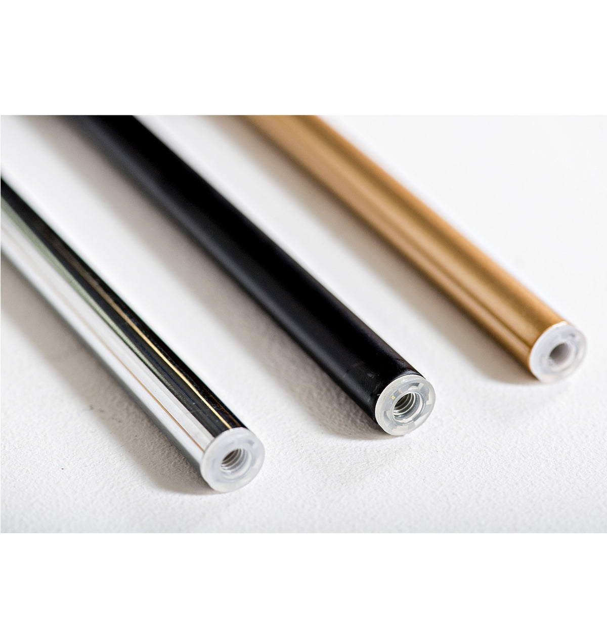 Metal wine rack support rods with threaded ends on white felt