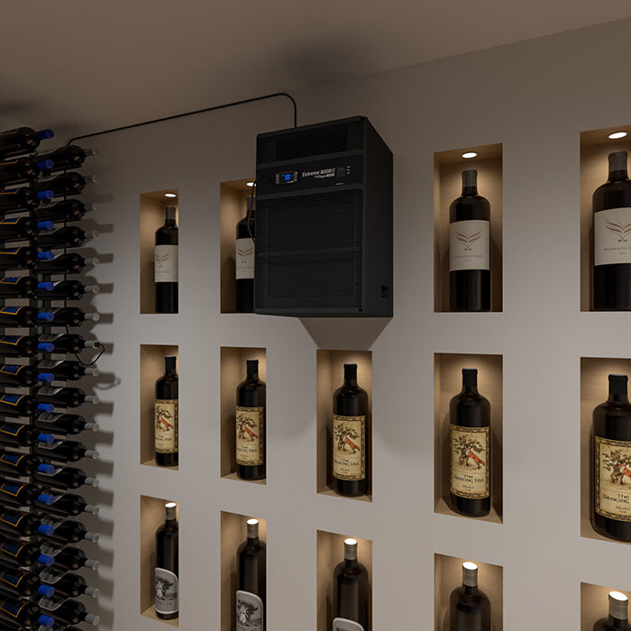 Through-wall cooling unit centered above a wall of wine bottles