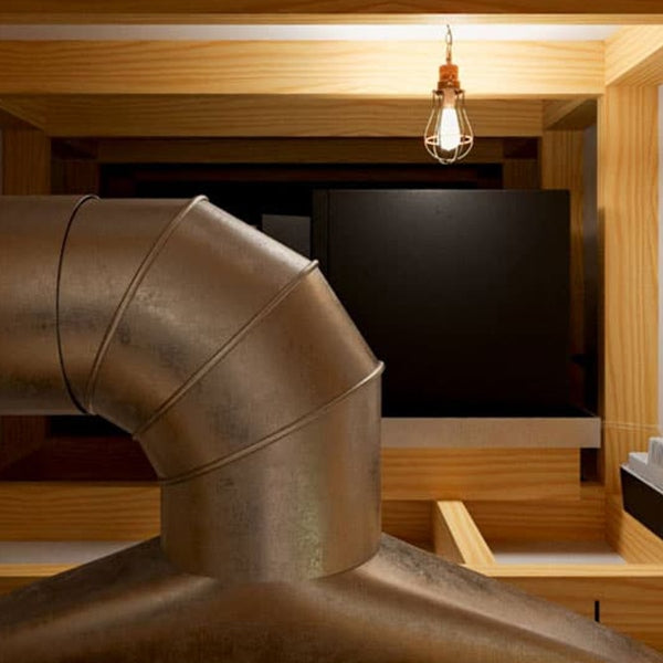 Silver ductwork with elbow bends for wine cellar cooling system installation