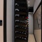 Wine cellar interior with wall control display and stocked bottle racks