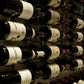 Close-up of wine bottles in a wall-mounted wine rack