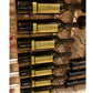 Wall-mounted wine rack with dark wine bottles on curved black metal arms