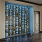 Front view of built-in wall wine rack with many wine bottles on black grid