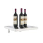 Wall wine shelf with three wine bottles on a light-colored rectangular shelf platform