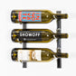 Wall-mounted wine rack with three wine bottles in metal holders, polished finish