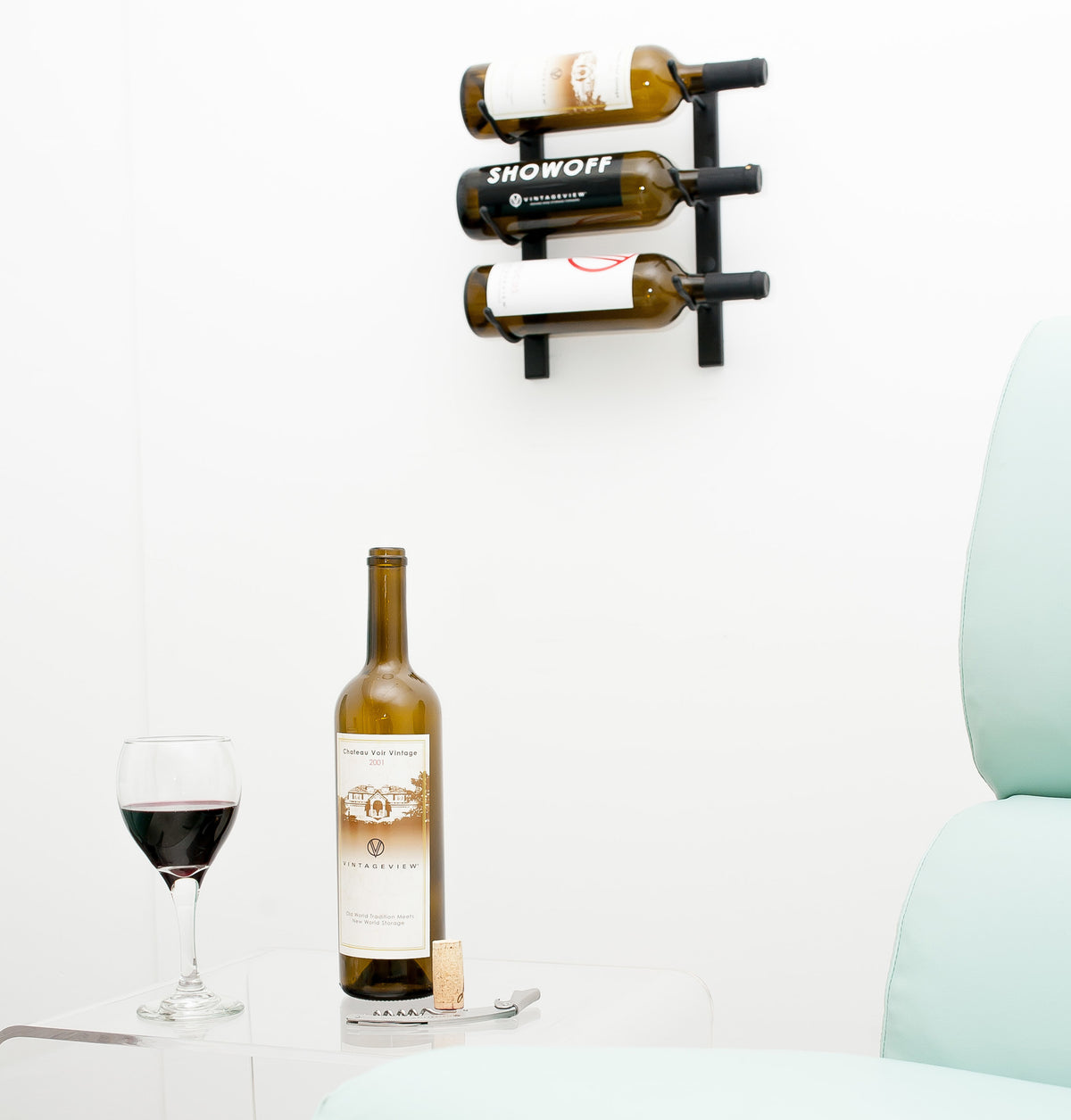 Wall-mounted wine rack with two wine bottles and metal bottle hooks