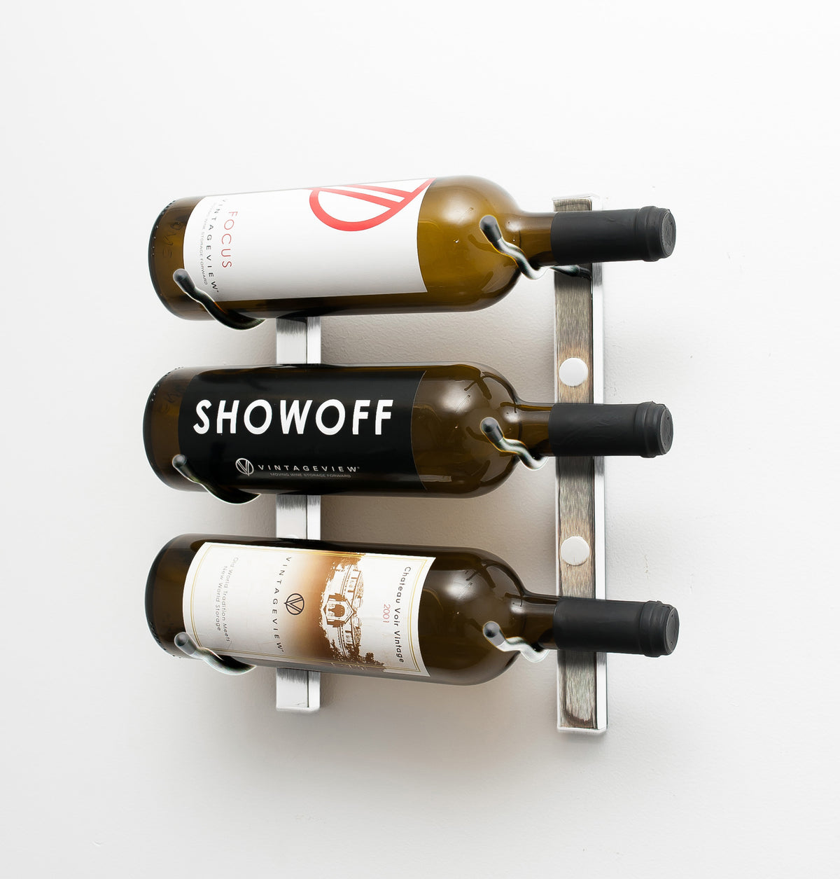 Wall-mount wine rack holding three wine bottles with black metal frame and curved pegs