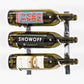 Wall-mounted wine rack with shiny metal frame holding three wine bottles