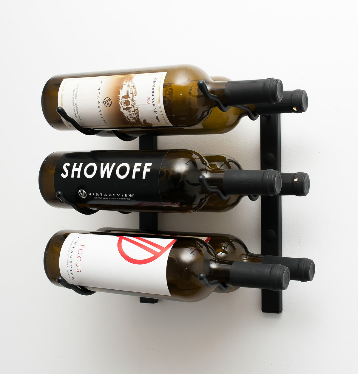 Wall-mounted wine rack with matte black frame holding three wine bottles