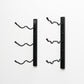 Wall-mount wine rack with two black vertical bars and six curved bottle pegs