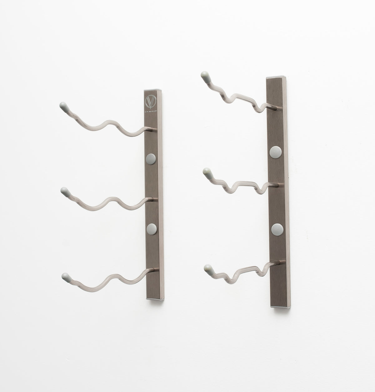Wall-mount wine rack with brushed metal bars and white curved bottle pegs