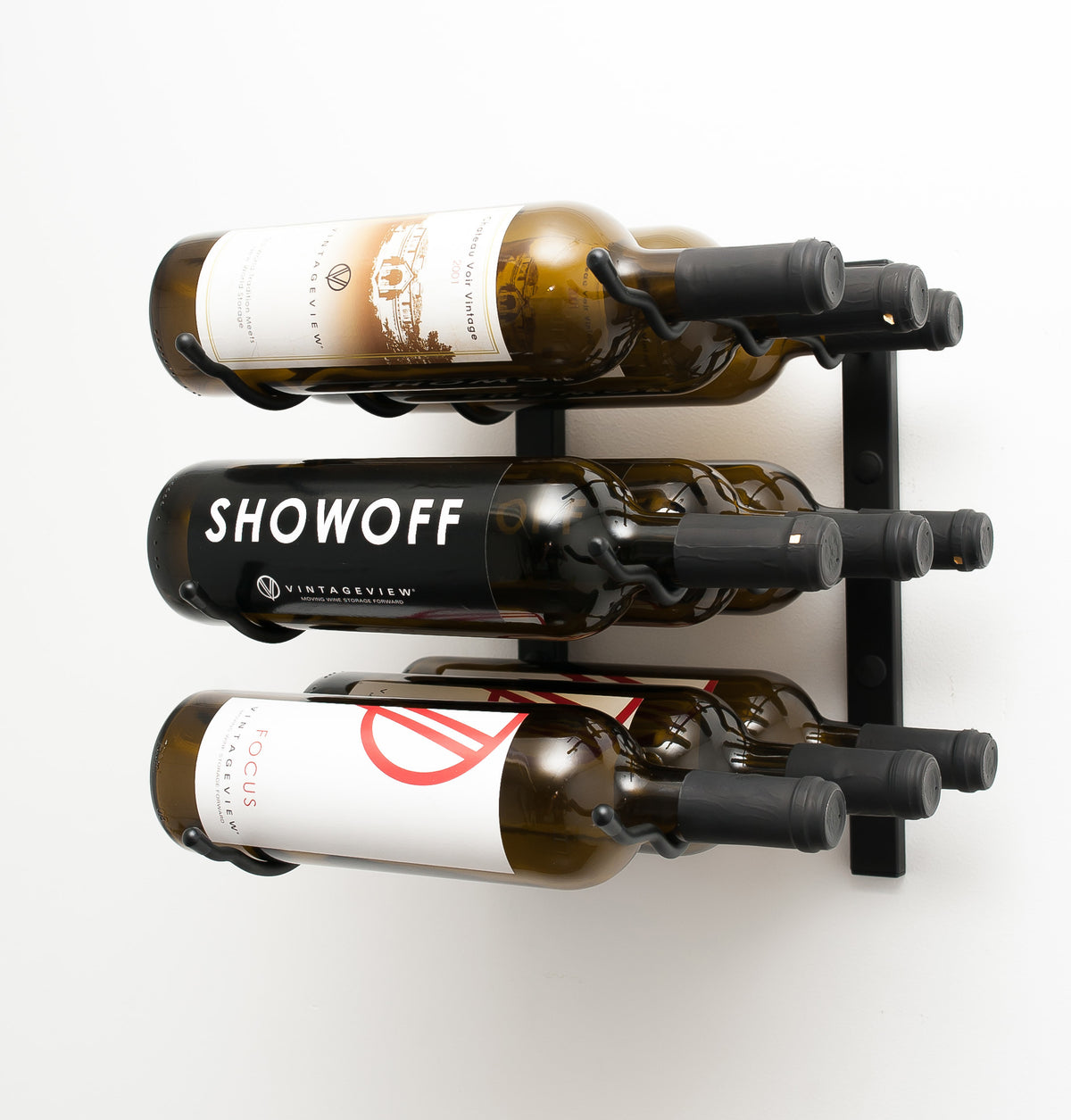 Wall-mounted wine rack with three bottle slots and assorted wine bottles on display