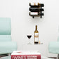 Wall wine rack with three bottle slots mounted on wall, holding a single wine bottle