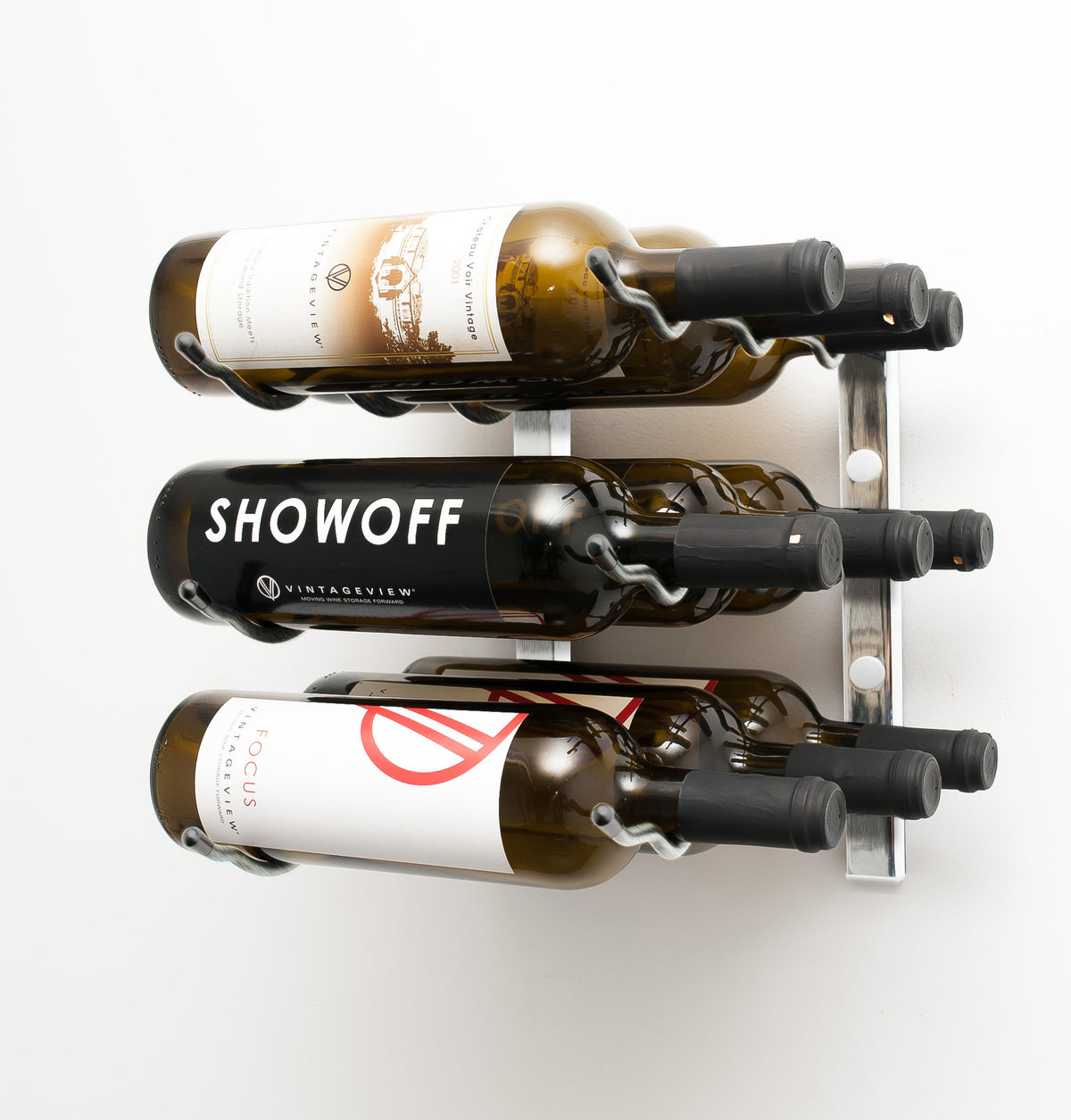 Wall-mounted wine rack with three bottle cradles holding assorted wine bottles