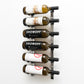 Wall-mounted chrome wine rack with bottle hooks holding SHOWOFF and labeled wines