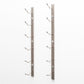 Wall-mounted wine rack rails with bottle hooks, brushed metal finish, empty