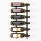 Wall-mounted wine rack with labeled wine bottles on metal pegs