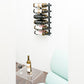 Wall wine rack with black pegs holding multiple wine bottles