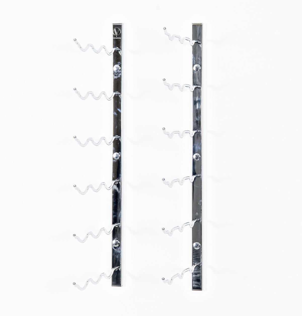 Wall wine rack with empty curved bottle holders on shiny chrome metal bars