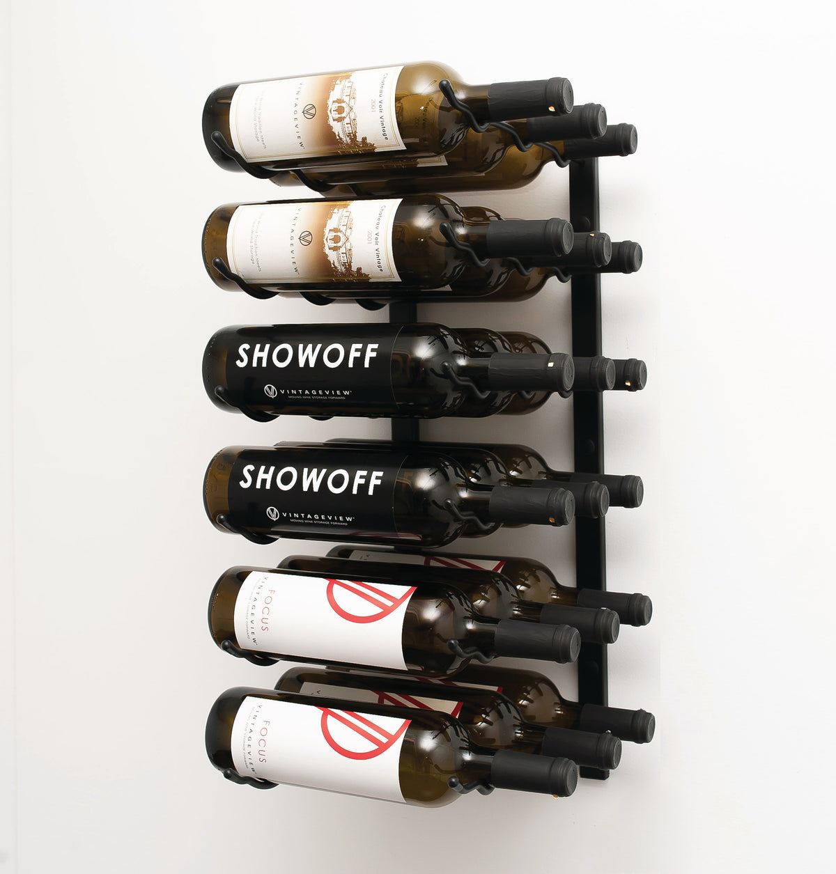 Wall wine rack with silver back and black pegs holding six wine bottles