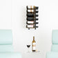 Wall wine rack with bottle holders and two wine bottles in the top row