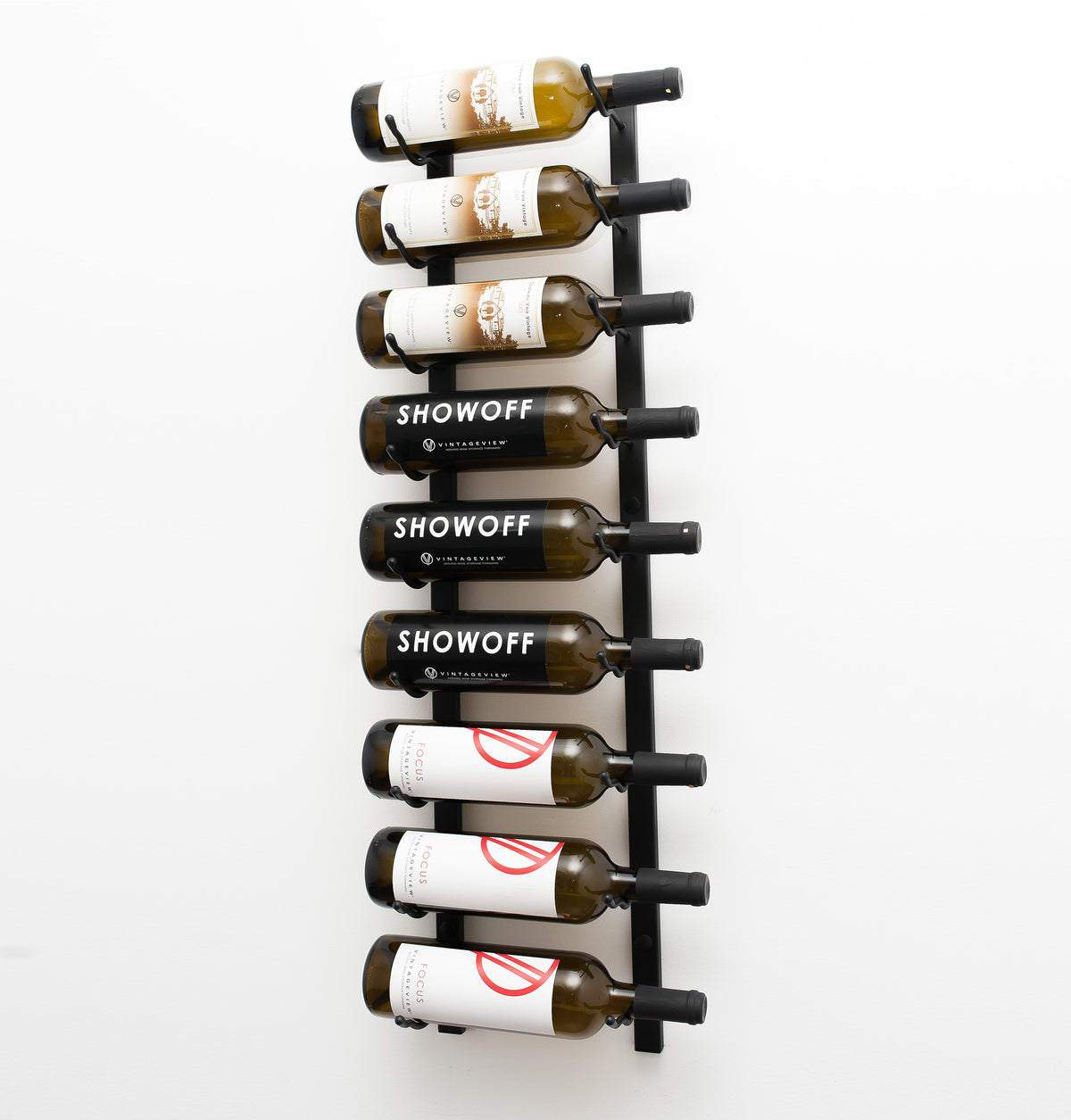 Wall-mounted wine rack holding wine bottles on black vertical bars
