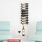 Wall-mounted wine rack with bottles above a table between two light blue chairs