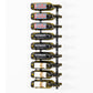 Wall-mounted wine rack with black bottle holders and wine bottles